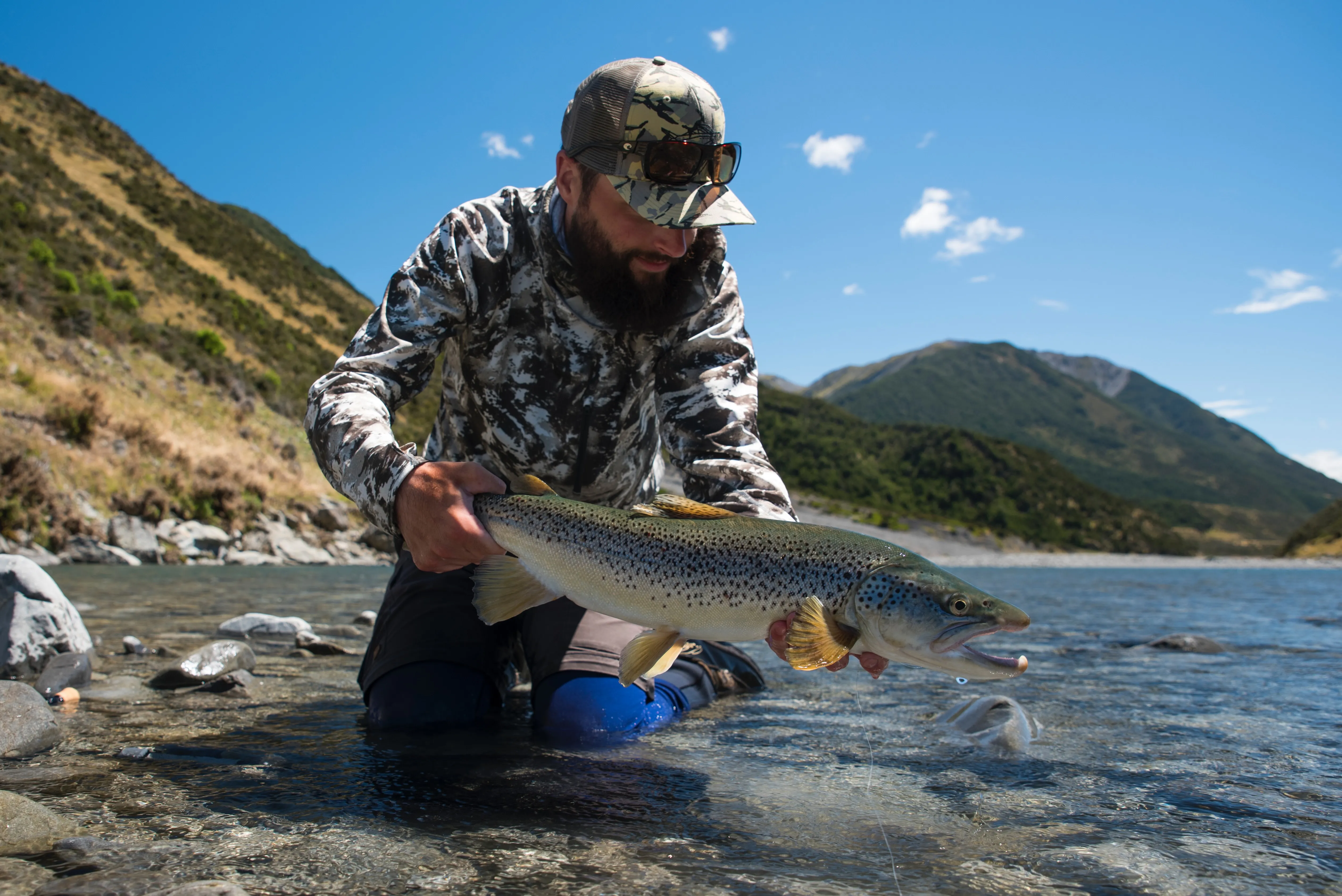 A beautiful brown trout caught on a dry dropper-rigged Pheasant Tail nymph that took the author for a ride down the rapids.